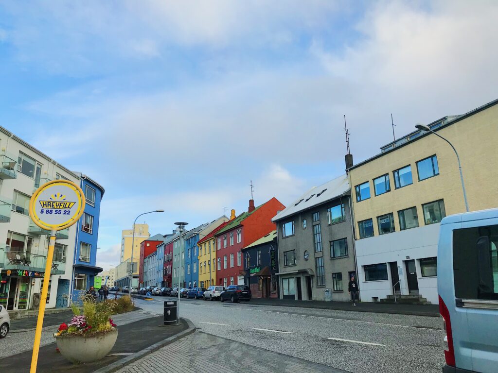 A picture of a street in Reykjavik with colourful houses lining the street.