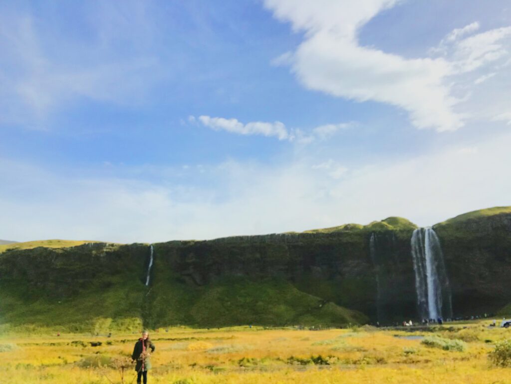 Becca standing in front of Seljalandsfoss